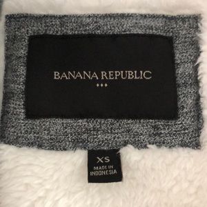 Dark grey winter vest with white fur lining